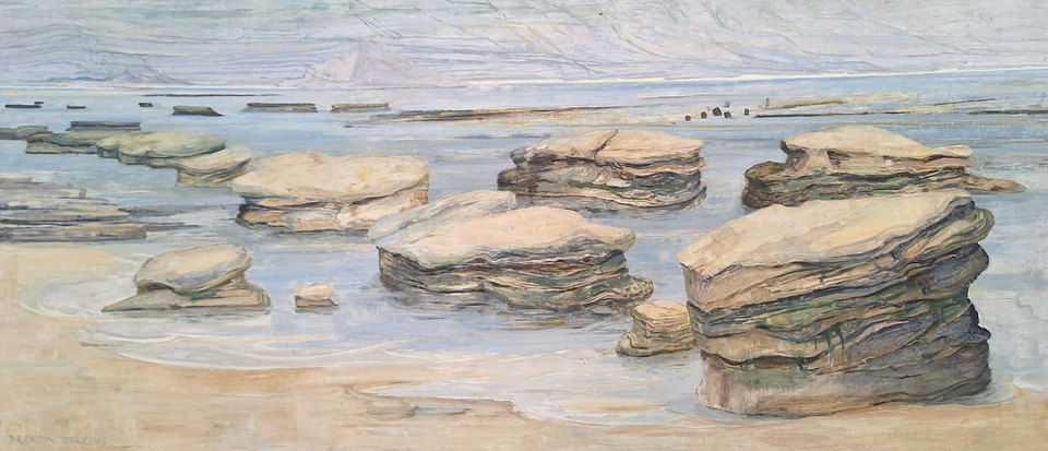 A wide painting of flat-topped, thinly layered rocks standing in shallow water on a sandy beach at low tide, in blue-greys and sand colours, with pale hills on the far shore.