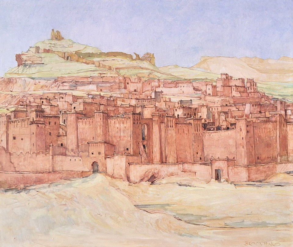 A painting of a fortified earthen town of terracotta towers and walls climbing a hillside to a ruined building on its summit, beneath a pale lilac-blue sky, with pale sand in the foreground.